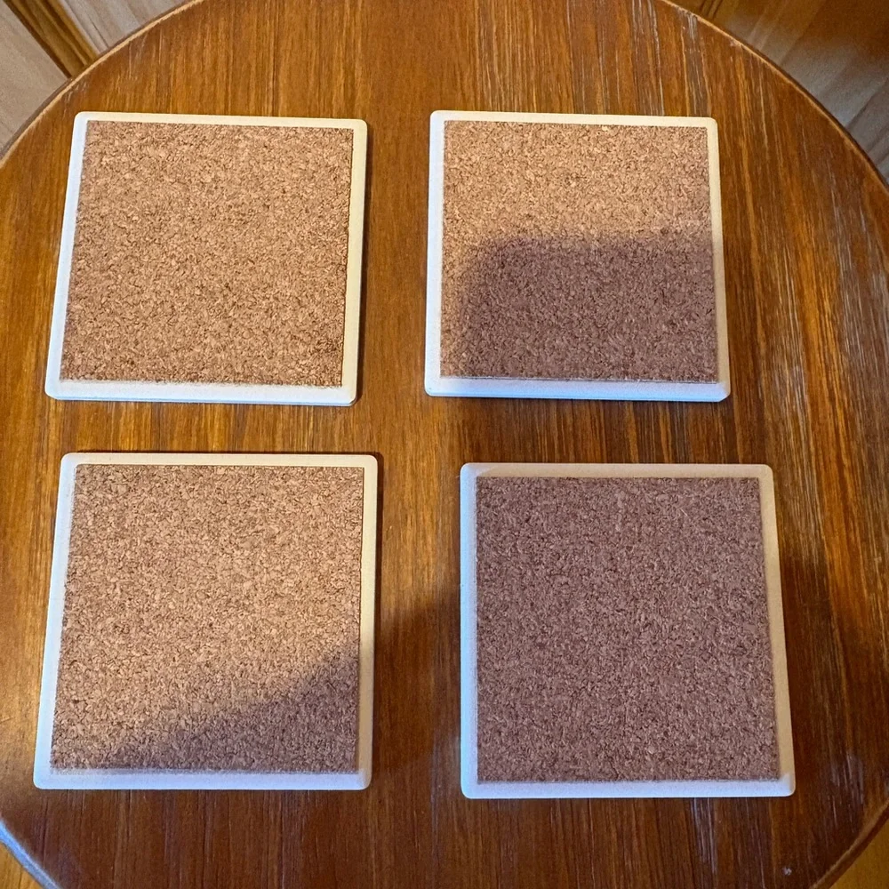 Vintage ceramic coasters depicting classic golf clubs.